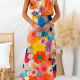 Estate | Robe maxi sans manches avec nœud à la taille et imprimé floral